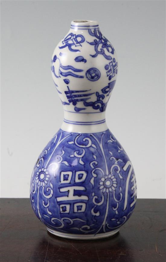 A Chinese blue and white double gourd shaped vase, possibly late Ming dynasty, 17cm, hairline cracks